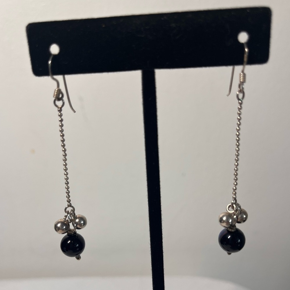 Silver and Black Dangle Earrings
925 posts
Funky design